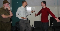 Monte bemused at the gestures of another 2 actors